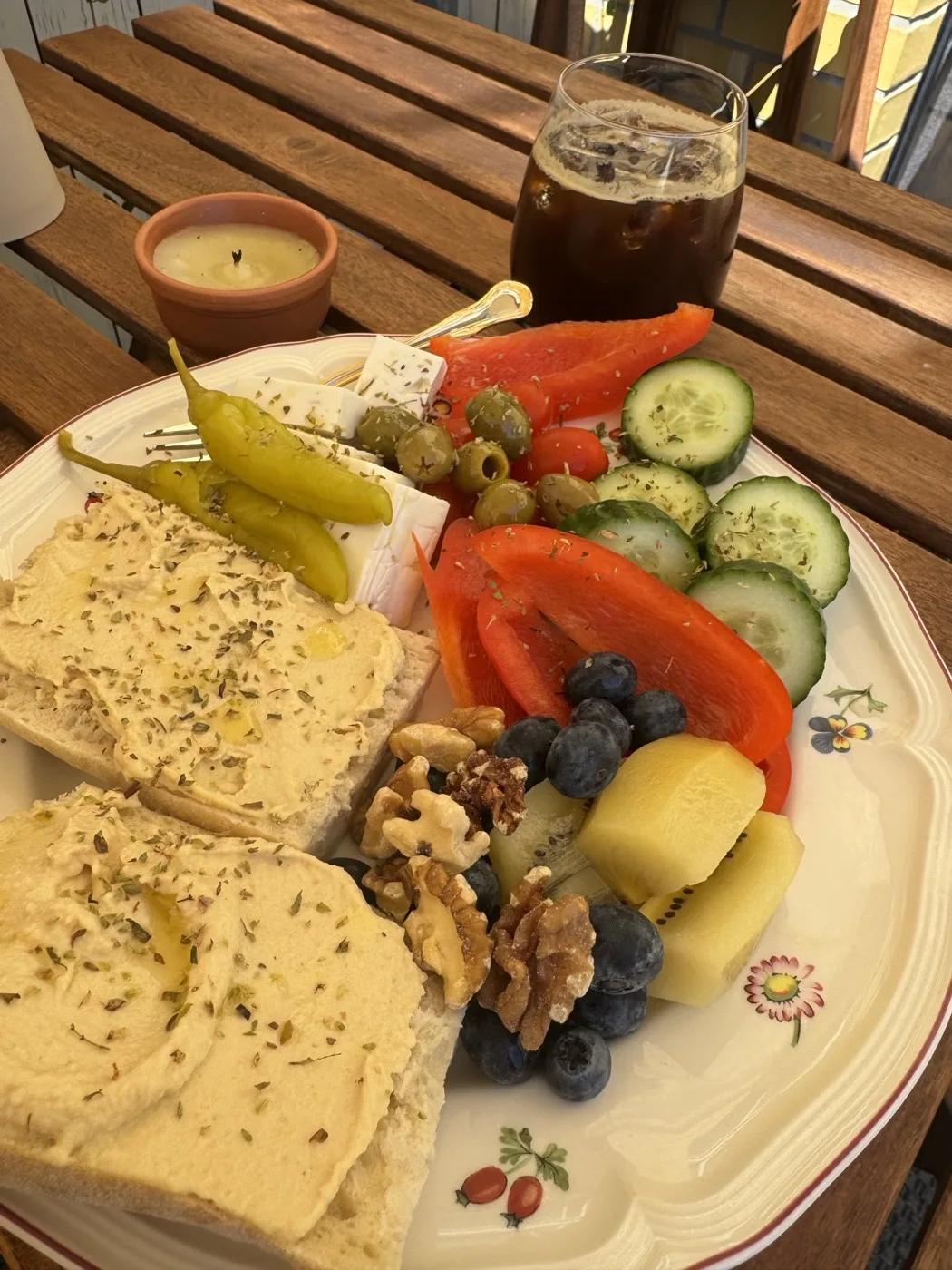 A colorful plate of food on a wooden table